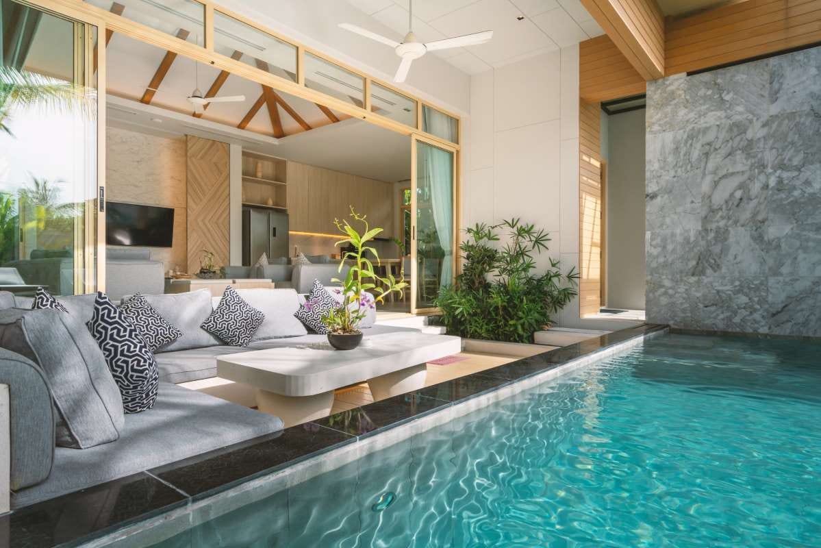 Luxury villa interior with living room and indoor swimming pool